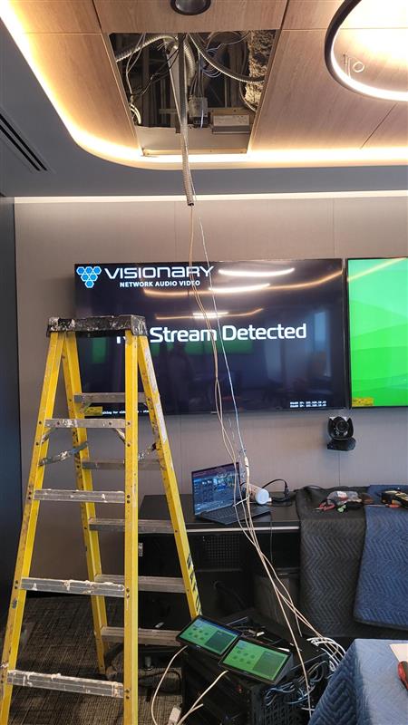 Conference room AV installation with ceiling cable routing and multiple displays